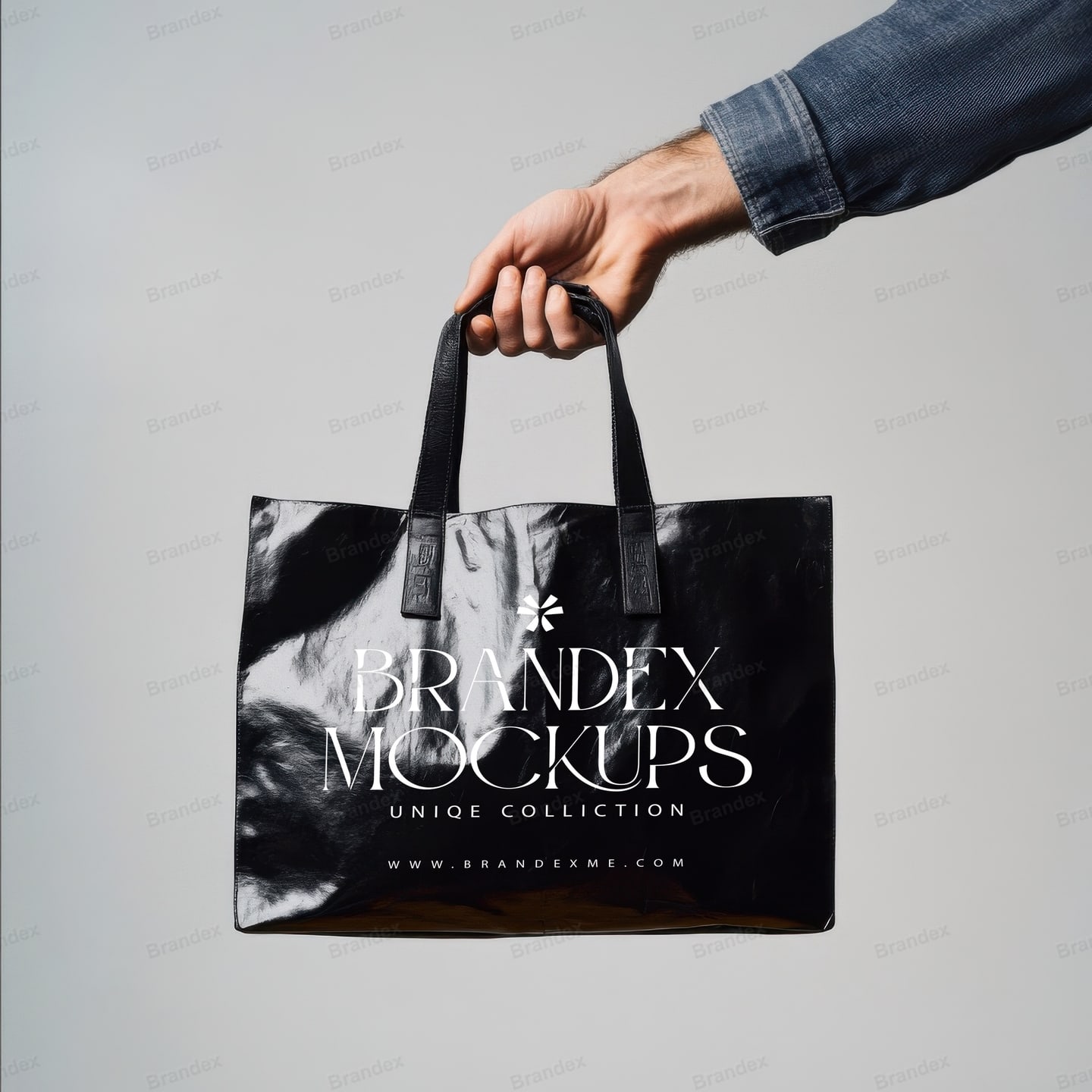 Black Glossy Tote Bag Mockup Held by Hand – Studio View